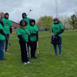 village earth day kids standing in a group with day